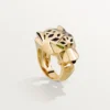 Anillo Panthere De Cartier – Oro amarillo, laca, granate tsavorita, ónix – Cartier