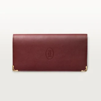 Billetera internacional con fuelles, Must de Cartier – Piel de becerro color burdeos, acabado dorado – Cartier