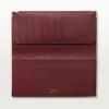 Billetera internacional con fuelles, Must de Cartier – Piel de becerro color burdeos, acabado dorado – Cartier Billetera internacional con fuelles, Must de Cartier – Piel de becerro color burdeos, acabado dorado – Cartier