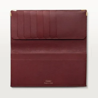 Billetera internacional con fuelles, Must de Cartier – Piel de becerro color burdeos, acabado dorado – Cartier