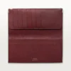 Billetera internacional con fuelles, Must de Cartier – Piel de becerro negra, acabado en acero inoxidable – Cartier Billetera internacional con fuelles, Must de Cartier – Piel de becerro negra, acabado en acero inoxidable – Cartier