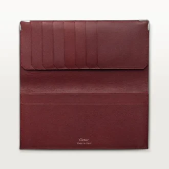 Billetera internacional con fuelles, Must de Cartier – Piel de becerro negra, acabado en acero inoxidable – Cartier