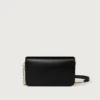 Bolso de cadena mini, Double C de Cartier – Piel de becerro negra, acabado en esmalte dorado y negro – Cartier Bolso de cadena mini, Double C de Cartier – Piel de becerro negra, acabado en esmalte dorado y negro – Cartier