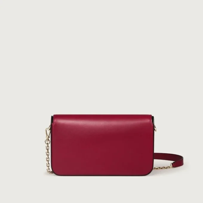 Bolso de cadena mini, Double C de Cartier – Piel de becerro rojo cereza, acabado en oro y esmalte rojo cereza – Cartier Bolso de cadena mini, Double C de Cartier – Piel de becerro rojo cereza, acabado en oro y esmalte rojo cereza – Cartier