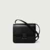 Bolso de hombro, Mini, Double C De Cartier – Piel de becerro negra, acabado en esmalte dorado y negro – Cartier Bolso de hombro, Mini, Double C De Cartier – Piel de becerro negra, acabado en esmalte dorado y negro – Cartier