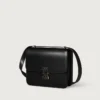Bolso de hombro, Mini, Double C De Cartier – Piel de becerro negra, acabado en esmalte dorado y negro – Cartier Bolso de hombro, Mini, Double C De Cartier – Piel de becerro negra, acabado en esmalte dorado y negro – Cartier