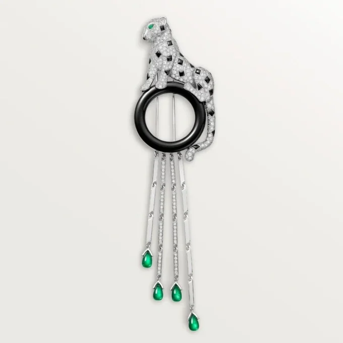 Broche Panthere de Cartier – Oro blanco, esmeraldas, ónix, diamantes – Cartier