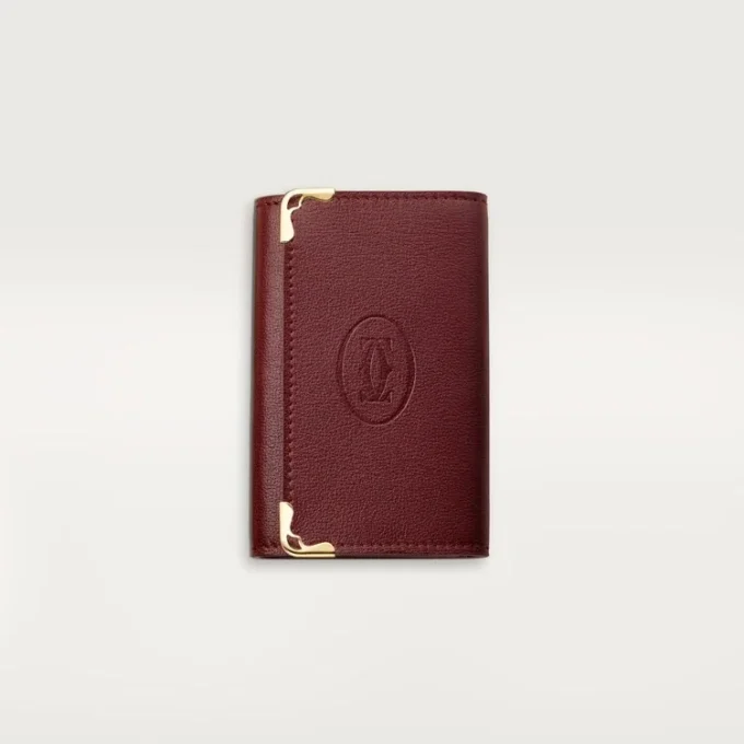 Llavero de 6 llaves, Must De Cartier – Piel de becerro burdeos, acabado dorado – Cartier