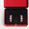 Pendientes de aro Clash de Cartier, ónix, modelo extragrande, diamantes