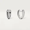 Pendientes pequeños de aro Panthere Diamond, oro blanco | Cartier Us